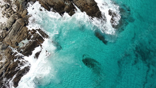 Aerial view, blue shallow water in south-west Australia. Little foamy waves and rocks. Located in Bremer Bay. Travel , road trip around western Australia.