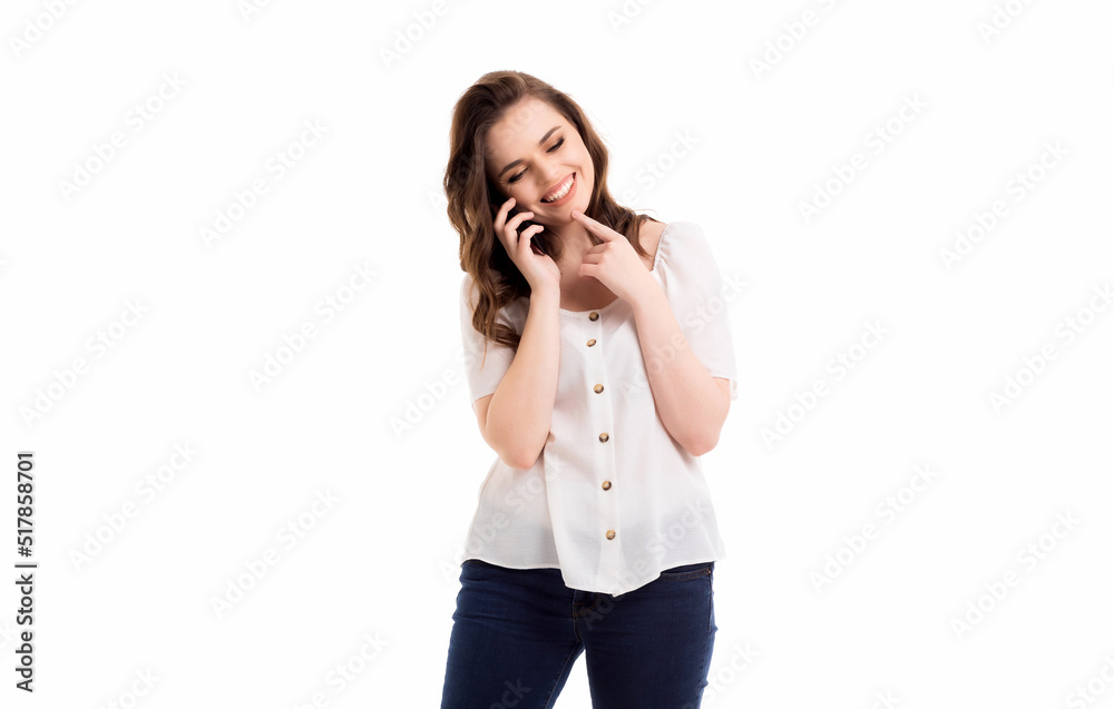 A woman communicates on a mobile phone. Emotions in communication. Girl on a white background. A woman communicates on a mobile phone. Emotions in communication. Girl on a white background.