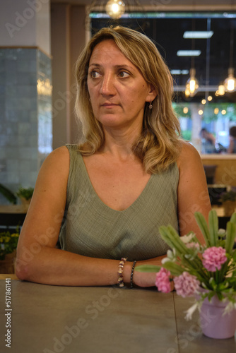 a girl drinks for an hour in a cafe