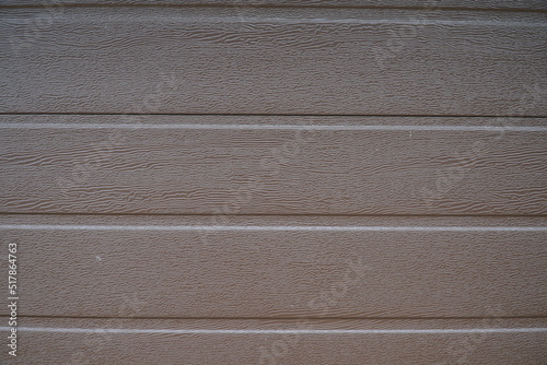 Obraz na plátně A fragment of a wall made of brown metal siding.