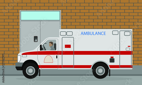 An ambulance with a driver stands near the house