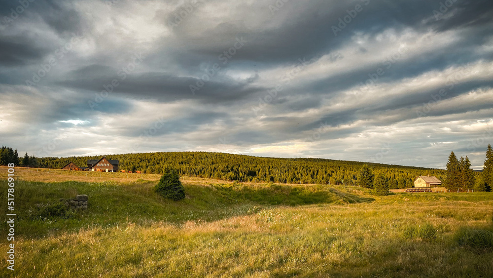 Fototapeta premium Mountain meadows in the summer sunset, Hamlet Jizerka, Jizera Mountains, Czech Republic