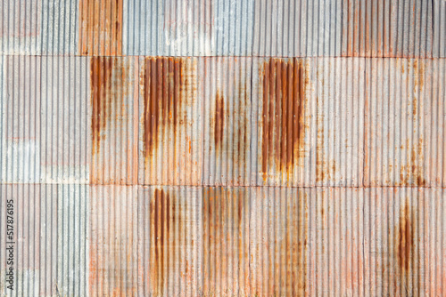 wall of rusty corrugated iron sheets photo
