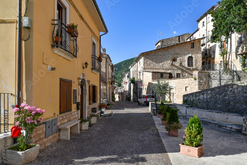 A narrow street between the old stone houses of Cansano, a medieval village in the Abruzzo region of Italy.  © Giambattista