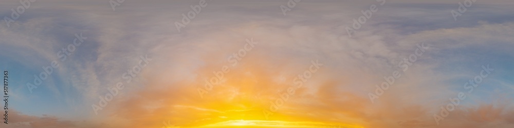 Obraz premium Golden glowing sunset sky panorama with Cirrus clouds. Hdr seamless spherical equirectangular 360 panorama. Sky dome or zenith for 3D visualization and sky replacement for aerial drone 360 panoramas.