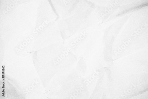 White crumpled recycled craft paper background. Abstract grey material texture old vintage page. 