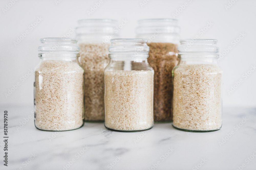 glass jar with rice of different varieties including jasmine basmati
