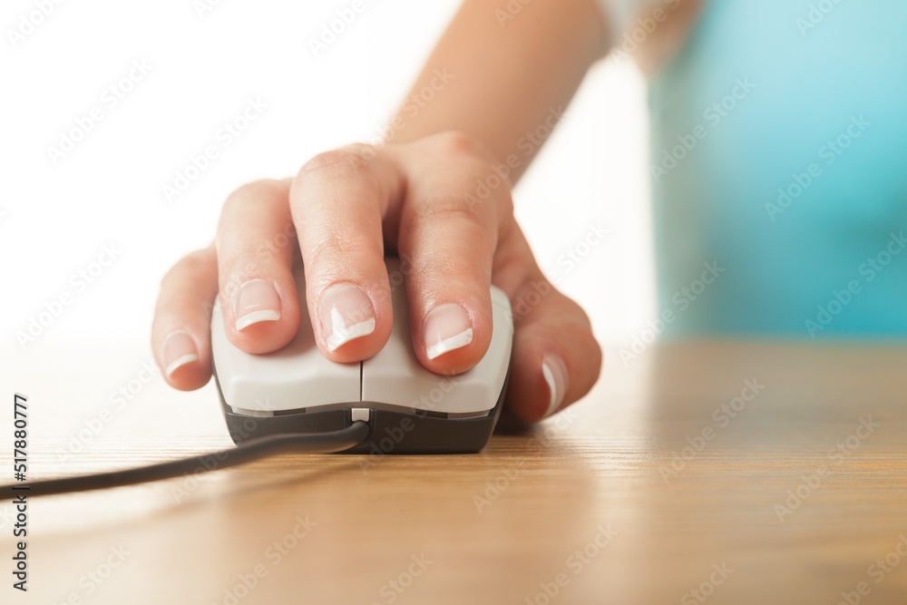 Closeup of Woman's Hand Using a Mouse Closeup of Woman's Hand Using a Mouse