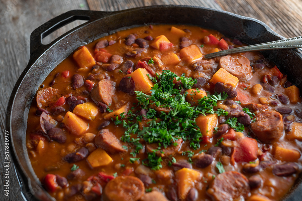 Mexican bean stew with chorizo salami, sweet potatoes and vegetables Mexican bean stew with chorizo salami, sweet potatoes and vegetables