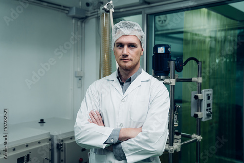 Male Scientist checking vaporizer during CBD oil extraction, hemp oil extraction process.