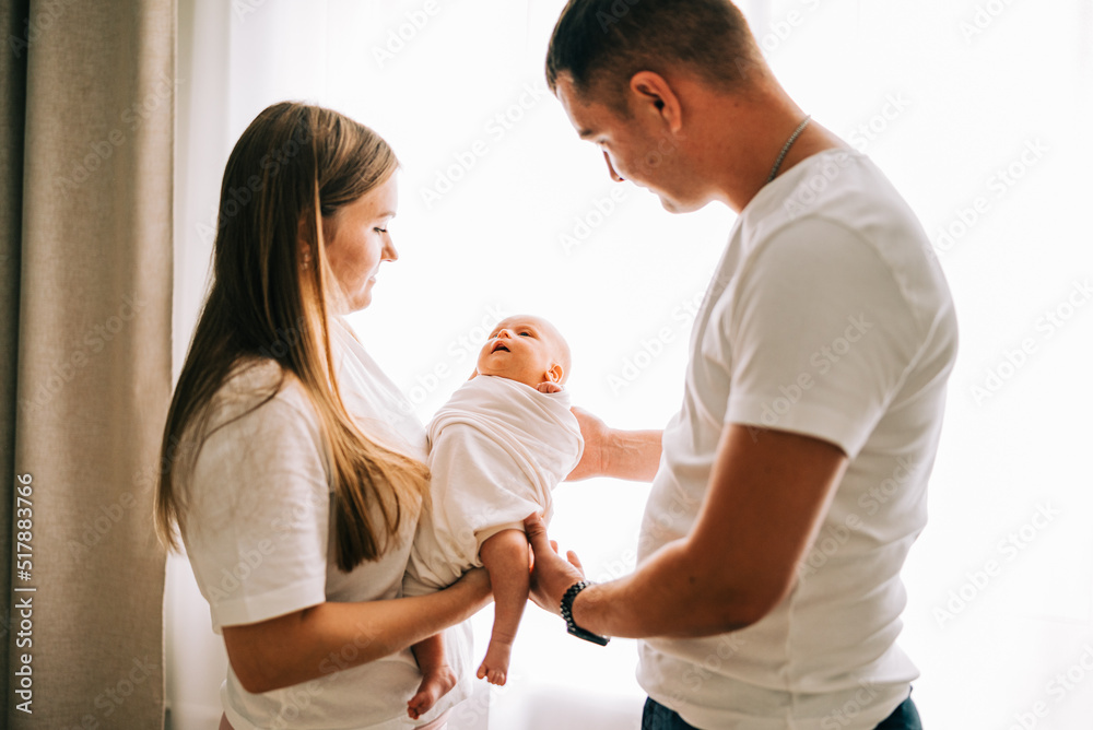 Newborn baby with happy parents. Happy family. Healthy newborn baby with mom and dad. Mother, father and infant baby. Cute Infant girl and parents Newborn baby with happy parents. Happy family. Healthy newborn baby with mom and dad. Mother, father and infant baby. Cute Infant girl and parents