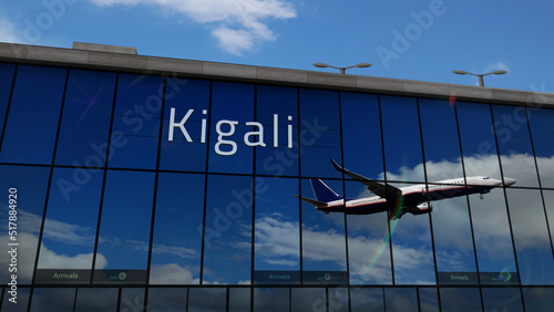 Airplane landing at Kigali Rwanda airport mirrored in terminal photo