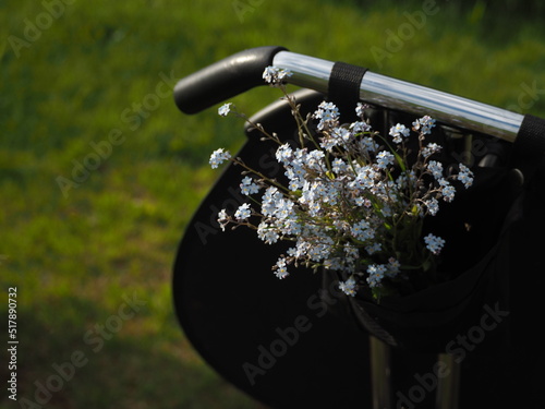 Bouquet of forget-me-not flowers in a basket on a bicycle in Provence style