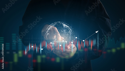 Man using mobile phone view check trading information, stocks, gold, oil price, concept of internet technology that can view all kinds variety transaction of trading information anywhere in the world.