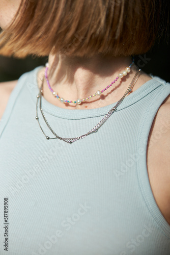 Modern jewelry made of beads and beads on the girl's neck. multi-colored jewelry made of beads and beads 