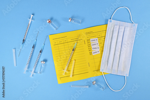 Concept for Corona virus booster vaccination showing vaccine passport with 4 entries photo