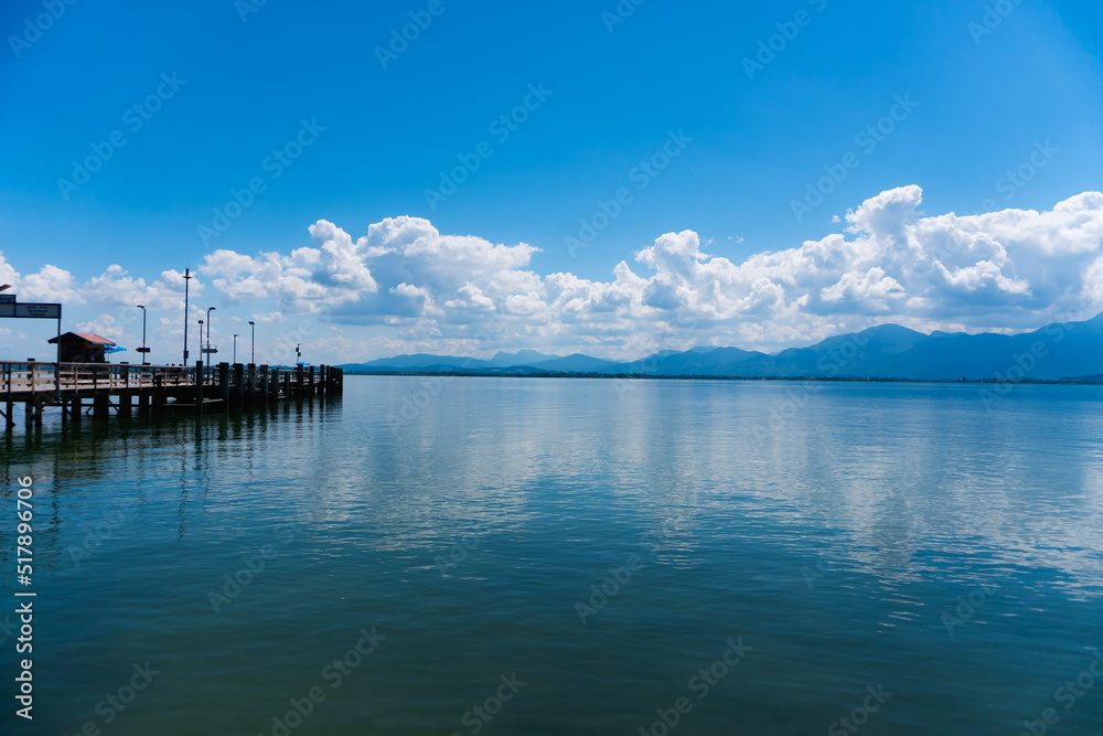 Chiemsee panorama at summer with a ferry dock and beautiful clouds