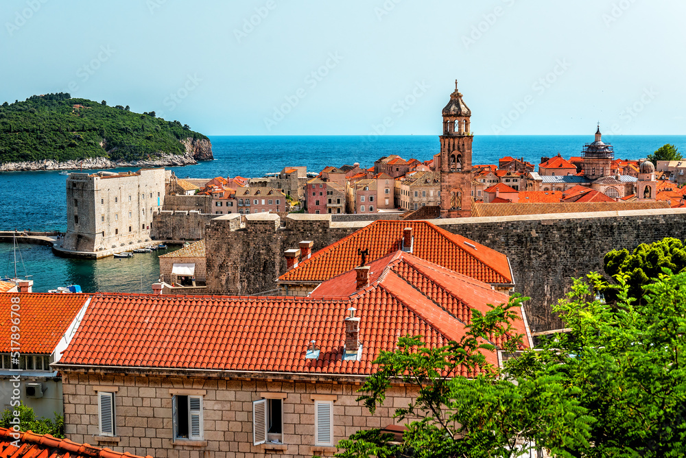 Red tiled roofs of Dubrovnik old town with the sea