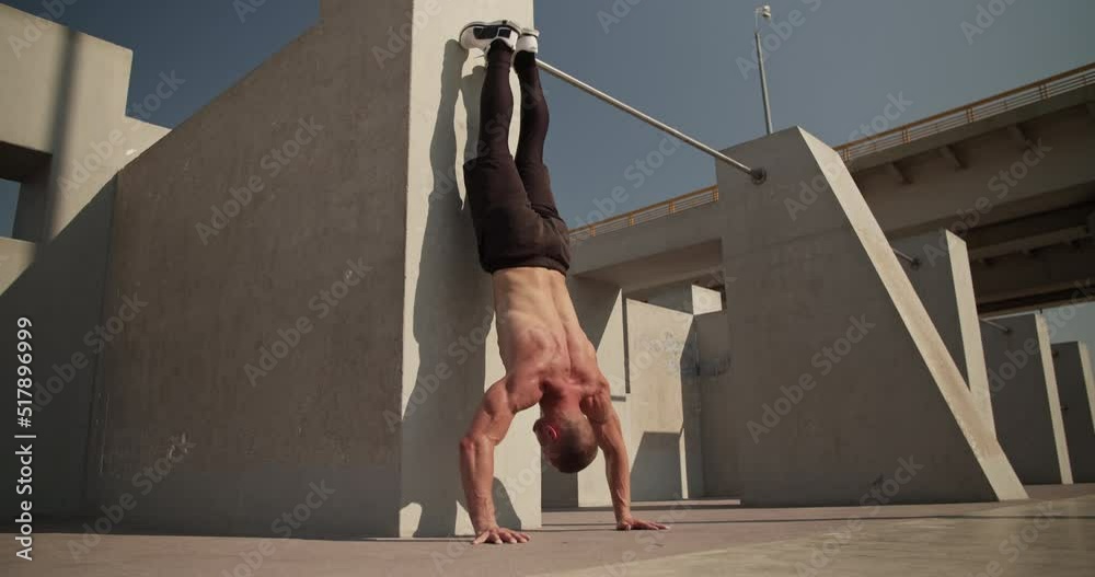 Sportsman doing handstand push ups
