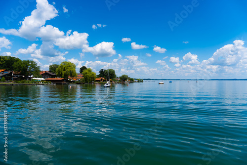 rifferbank from a lake (Chiemsee, Germany) with sun and beautiful clouds