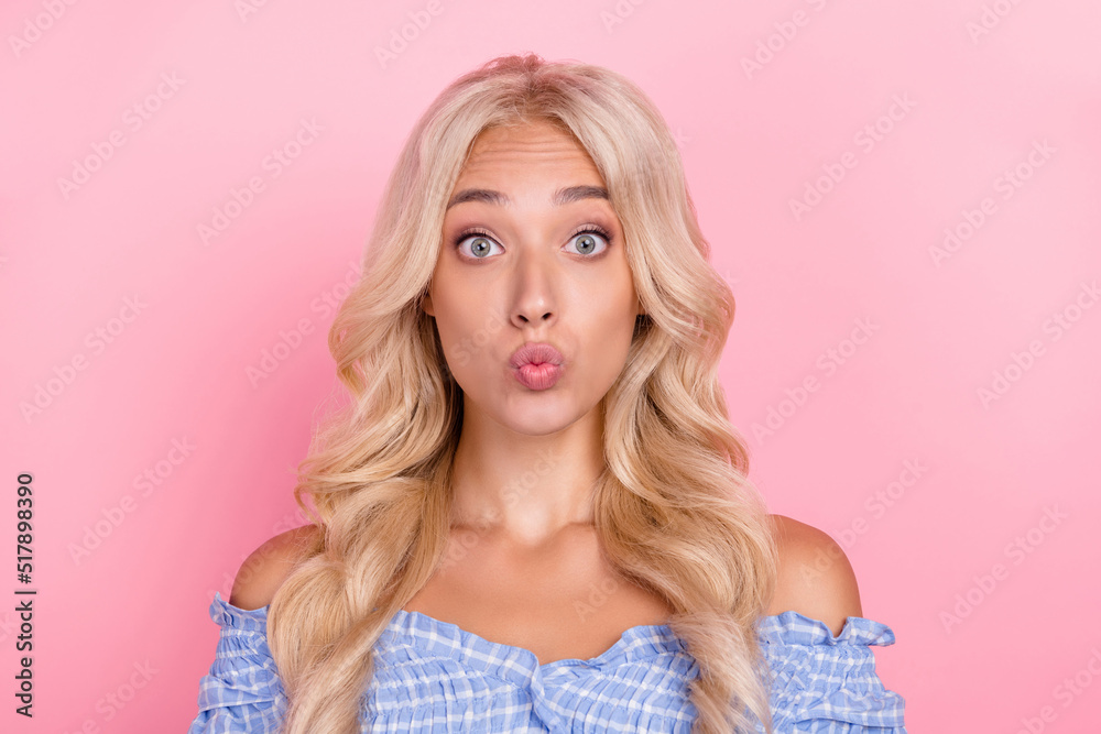 Photo of adorable impressed young girl dressed blue top sending you kiss isolated pink color background Photo of adorable impressed young girl dressed blue top sending you kiss isolated pink color background