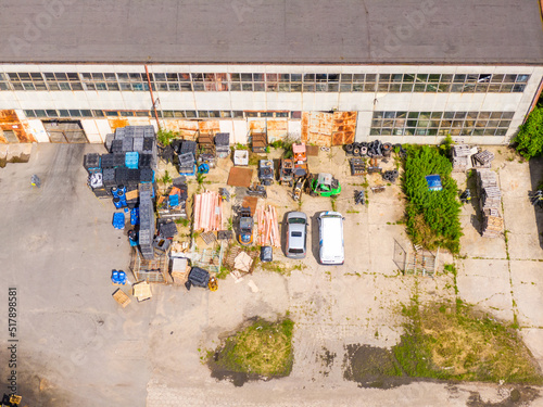 Aerial view of storage with rows of discarded broken cars. Recycling of old