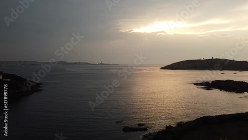Sunset over the sea by drone. Tower of Hercules. 4k cinematic drone video. High quality 4k footage