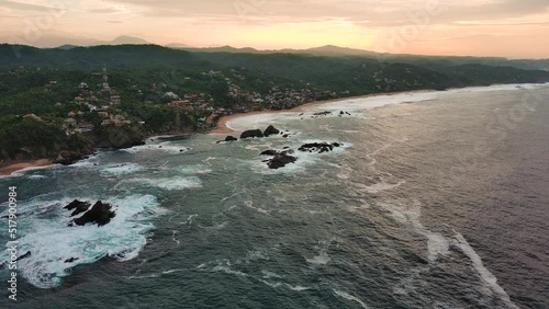 Aerial Drone Fly Above Ocean Shore Mazunte Mexican Beach Town Oaxaca Surfing Sun photo