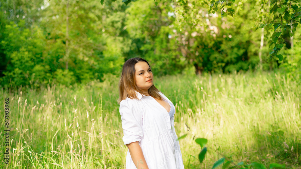 Portrait of a young beautiful brunette in the park Portrait of a young beautiful brunette in the park