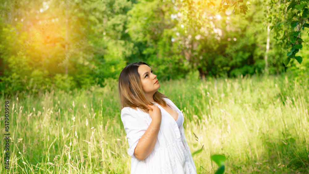 Portrait of a young beautiful brunette in the park Portrait of a young beautiful brunette in the park