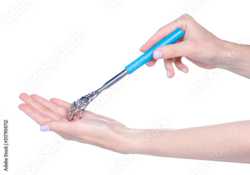 Metal back scratcher in hand on white background isolation, top view photo