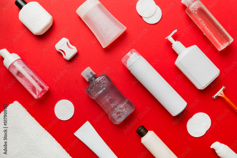 Naklejka premium Mockup for bathing products top view flat lay, spa razor, toothpaste, soap, gel and other various accessories. Cosmetics for skin health. Bath Mockup for your logo