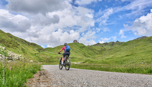nice active senior woman riding her electric mountain bike in the silvretta mountain range near Gaschurn, Tyrol, Austria © Uwe