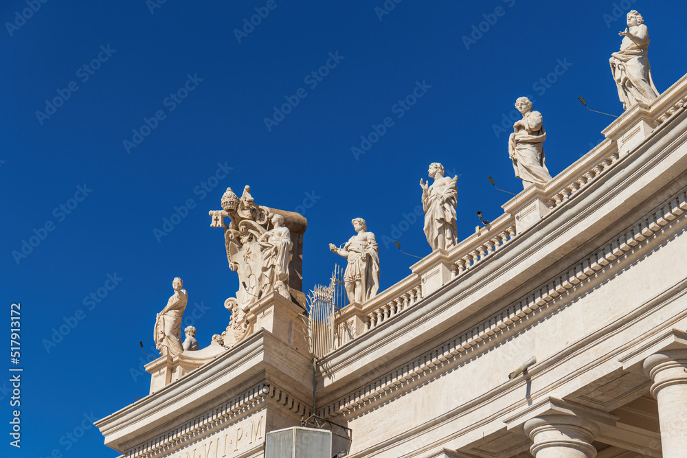 View of the colonnade with statues of saints surrounding St. Peter's Square