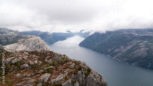 Impressive Lysefjord between high mountains on a cloudy day passing Preikestollen