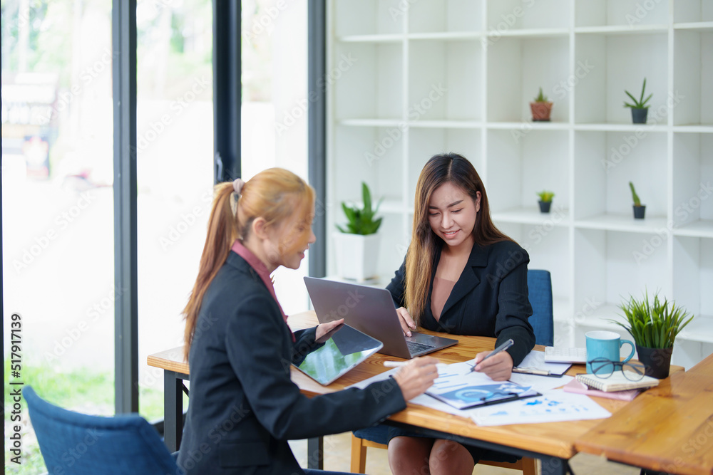 Portrait of a young Asian businesswoman consulting, planning marketing to improve product quality for customers Portrait of a young Asian businesswoman consulting, planning marketing to improve product quality for customers