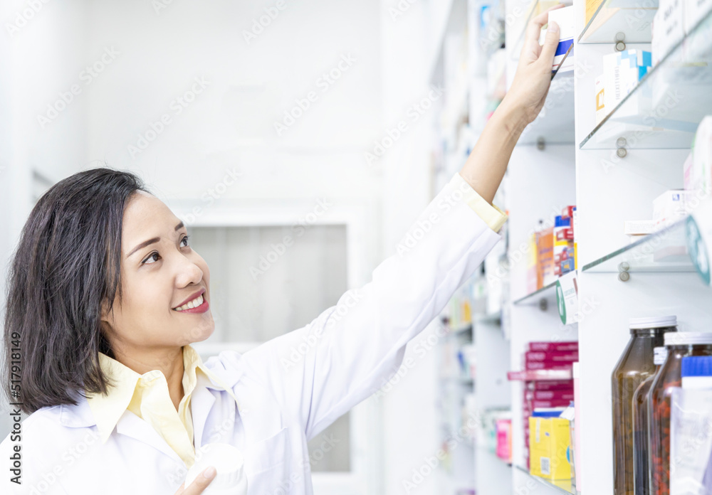 female Pharmacist working in drug store