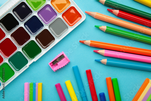 School supplies on blue background. Back to school concept.