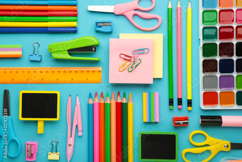 School supplies on blue background. Back to school concept.