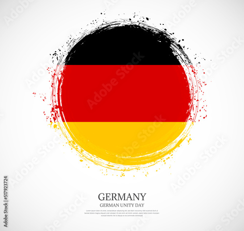 Creative circular grungy shape brush stroke flag of Germany on a solid background