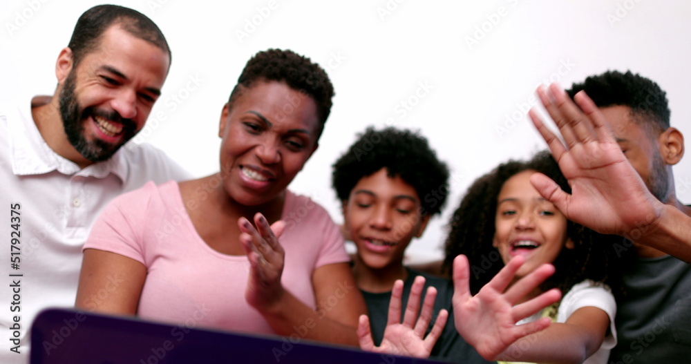 Obraz premium Happy African family talking to relatives on laptop computer