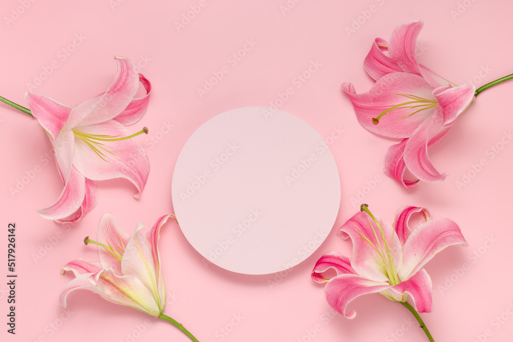 Empty round podium with flowers top view on pink background. Showcase with lily flower for product presentation