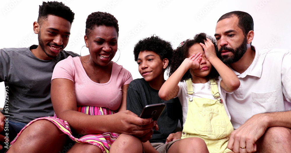 Obraz premium Family using phone at home couch, tired sleepy daughter