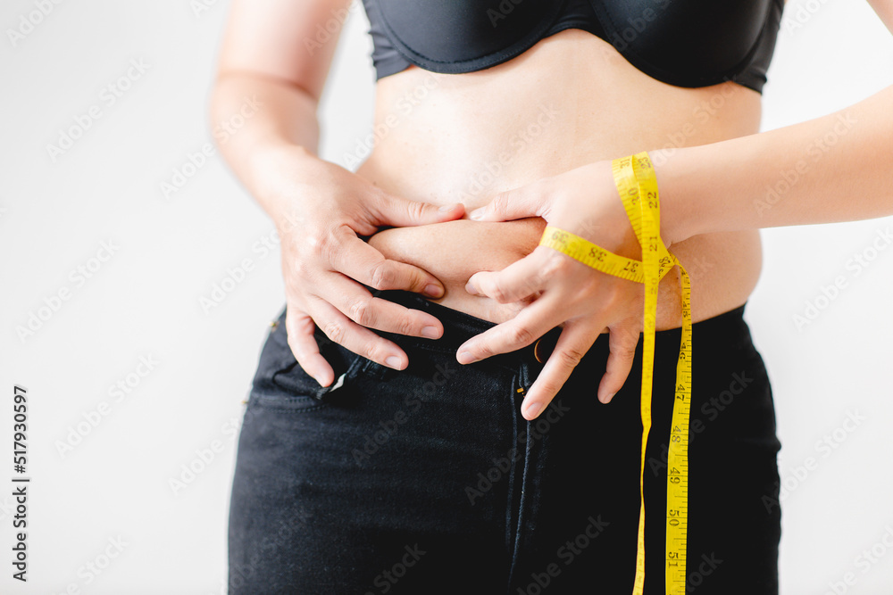 Φωτογραφία Woman hand holding excessive belly fat, Overweight fatty belly of woman, fat woman, fat girl, Woman diet lifestyle to reduce belly, Fat and Health concept