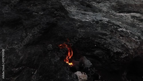 Flaming rock (Yanartas or Yanartash) is generally believed to be ancient Mount Chimera ( Antalya, Turkey) video. Wonder-fires have been burning for at least 2500 years. Chimera fire in evening footage photo