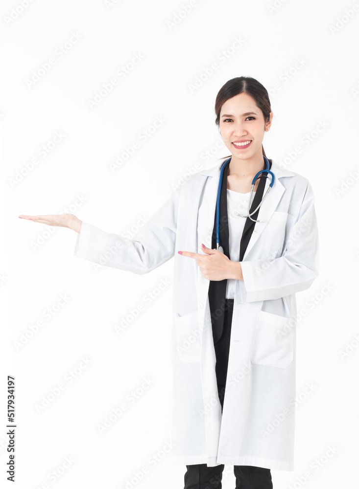 A picture of a confident Asian woman doctor presenting and showing copy space for product or text.Multiracial Asian / Caucasian female medical professional isolated on a white background. A picture of a confident Asian woman doctor presenting and showing copy space for product or text.Multiracial Asian / Caucasian female medical professional isolated on a white background.