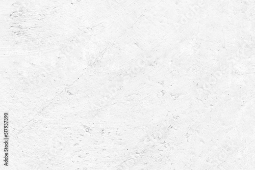 Old white painted concrete wall texture. Whitewashed aged cracked cement slab. Light grunge textured abstract background