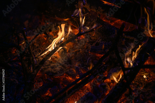 Burning apple tree branches in the fire. The custom of making a bonfire on spring holidays.