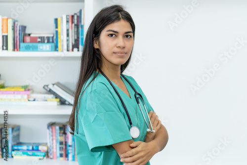 Beaututiful serious south american female nurse or doctor photo