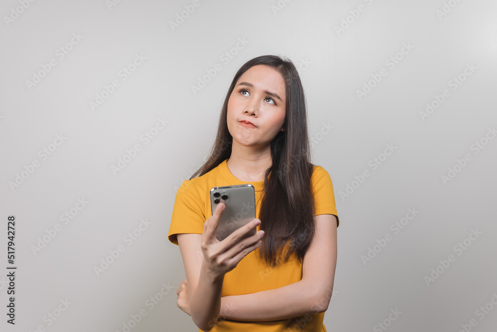 asian woman in color casual dress thinking and imagination isolated on pink background asian woman in color casual dress thinking and imagination isolated on pink background